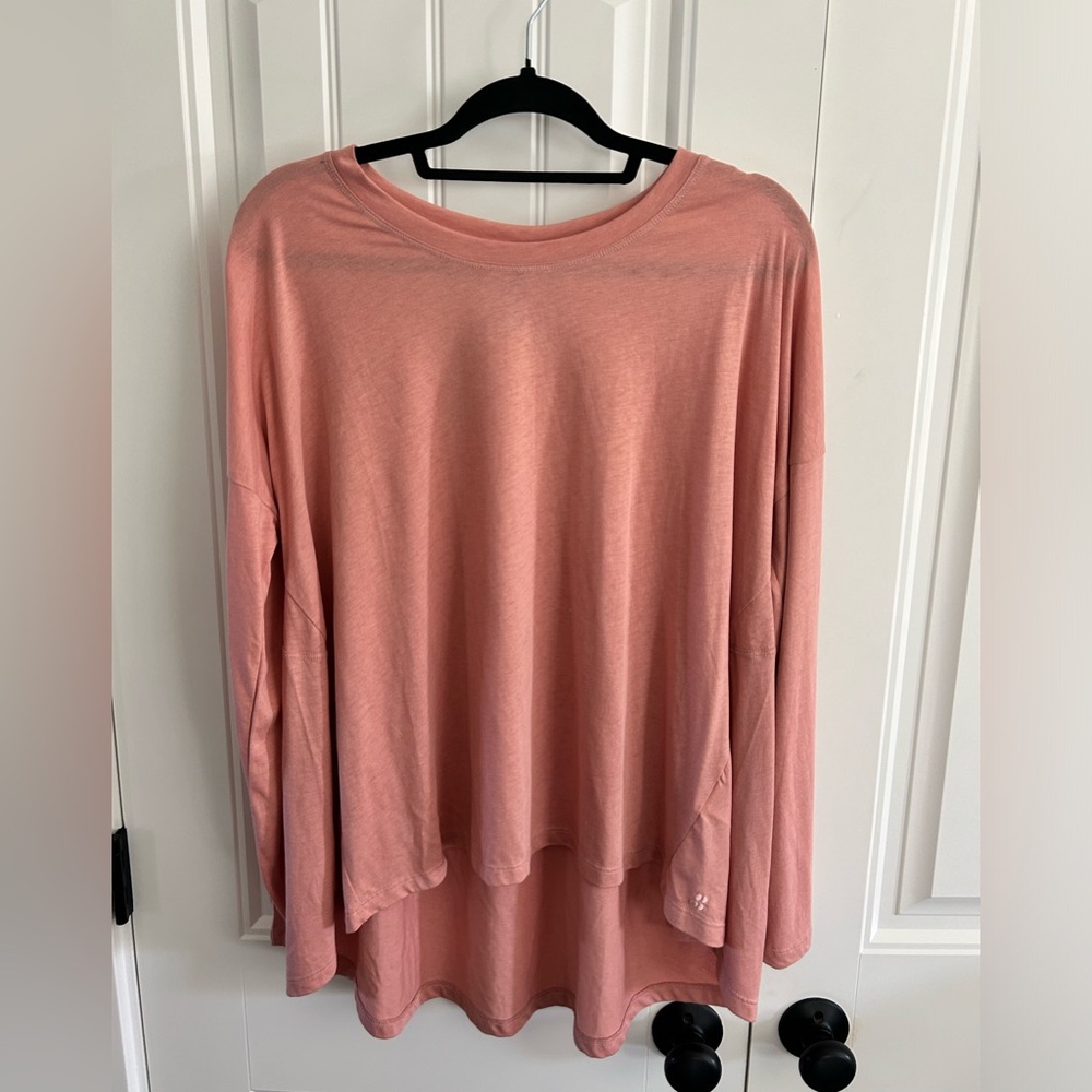 Sweaty Betty large bloom pink athletic top, made with natural yarn